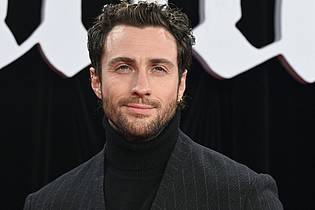 Jens Kalaene/dpa | Bei der Suche nach einem neuen James-Bond-Darsteller gilt Aaron Taylor-Johnson als heißer Kandidat. (Archivbild)